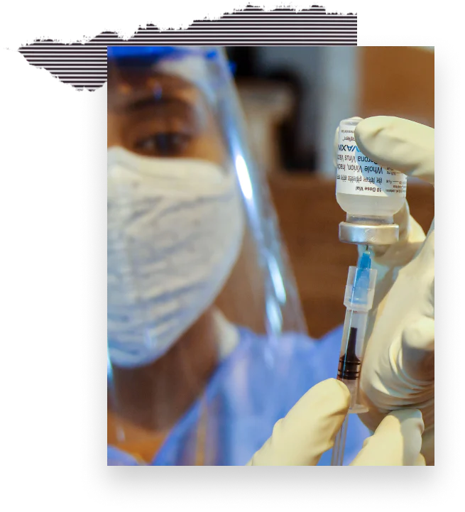Close-up of a medical worker filling a syringe