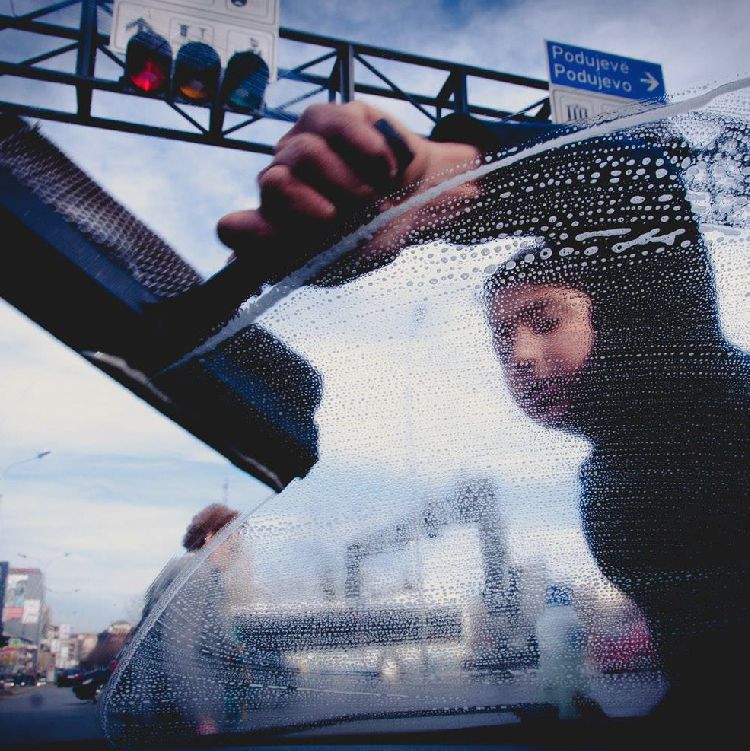 Photograph of a woman working in the streets illustrating the concept of transparency